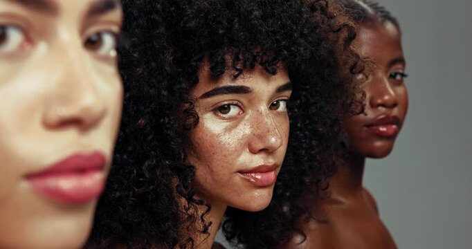Face, diversity and group of women with cosmetics, beauty and natural makeup in studio together. Skincare, dermatology and girl friends with solidarity, empowerment and confidence on grey background.
