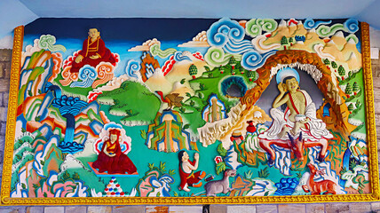 Intricate carvings depicting stories from Lord Buddha's life on the walls of Thupsung Dhargye Ling Monastery, Dirang, West Kameng, Arunachal Pradesh, India.