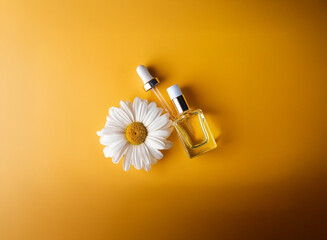 Fototapeta premium A single chamomile flower rests beside a clear glass bottle with a dropper, both set against a vibrant yellow background. The image suggests natural beauty products or skincare.