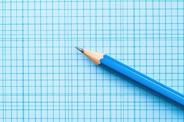 Blue graph paper background ideal for sketching or writing.