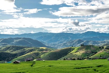 Fototapeta premium Scenic Green Hills Under Blue Sky Landscape