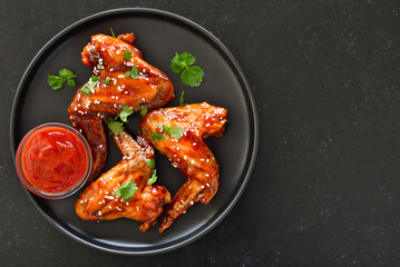 Baked chicken wings on plate
