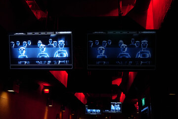 Two Computer Screens Showing People In A Virtual Cinema Sitting On Moving Rotating Chairs