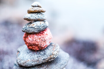 Peaceful Cairn of Smooth Stones Stacked Perfectly Creating Harmony in Nature's Tranquil Setting with Soft Background Focus Enhancing Colors and Contrast