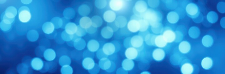 Obraz premium Beautiful abstract blue bokeh background creates a serene and dreamy atmosphere for various design needs