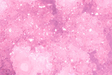 Amethyst pink crystals. Gems. Mineral crystals in the natural environment. Texture of precious and semiprecious stones. Seamless background with copy space colored shiny surface of precious stones.