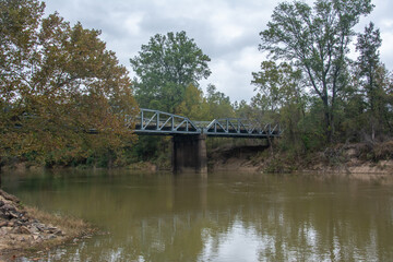 Autumn scenery and a bridge view over the Little Missouri River, or Little Mo running from the Ouachita Mountains of southwest Arkansas, USA