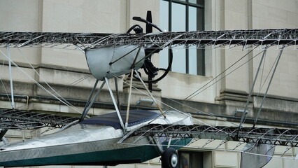 The old airplane is being exhibitted in front of the museum