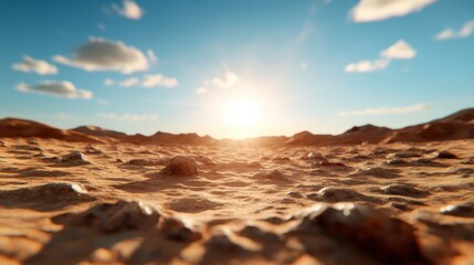 Naklejka premium The sun's rays illuminate a rocky desert terrain as it sets over the horizon, creating a captivating scene of natural beauty and tranquility against a blue sky.