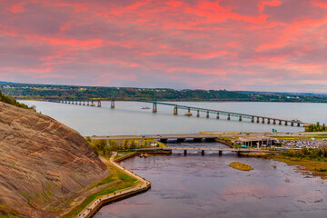 A view towards the bridge over the Saint Lawrence river from the top of the Montmorency falls near...