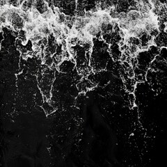 Obraz premium Water flows from the shower on a black background. Overlay template.