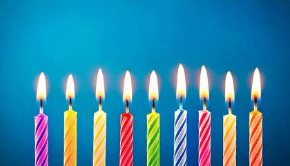 9 birthday candles in a row on a blue backdrop
