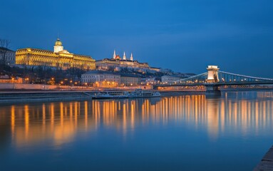 Eastern European city with historical architecture along the river, and beautiful scenery at night