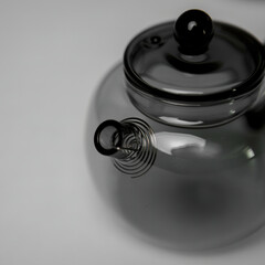 A Stylish and Modern Glass Teapot that Features a Unique and Intriguing Spout Design