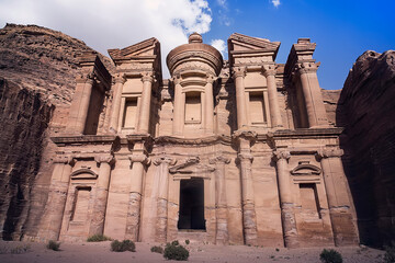 Stunning view from a cave of the Ad Deir - Monastery in the ancient city of Petra, Jordan. UNESCO world heritage site. Lost city in the mountains. one of the modern wonders of world