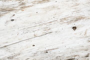 A white wooden panel with diagonal wood grain pattern