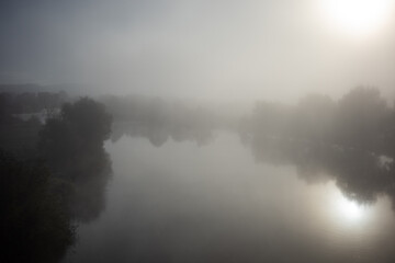 river in the morning fog