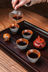 Experience the enriching and cultural Traditional Tea Ceremony featuring a teapot and elegant cups