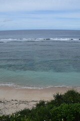 The turquoise blue Pacific Ocean and green lush island landscapes of Polynesian Tonga