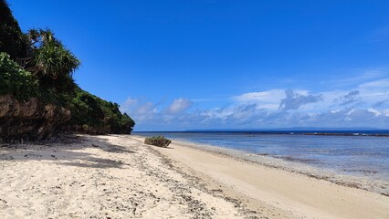 The turquoise blue Pacific Ocean and green lush island landscapes of Polynesian Tonga