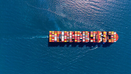 Aerial top view container cargo ship in the blue sea.