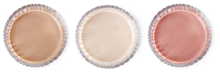 Protein shakes of different flavors in glasses isolated on white, top view