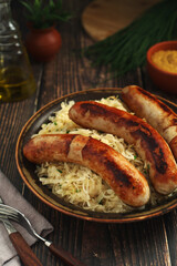 A bowl with Bratwurst and Sauerkraut as side dish - traditional German food