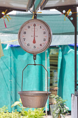 Mechanical Analogue Hanging Scales With Pan at Farmers Market Stall