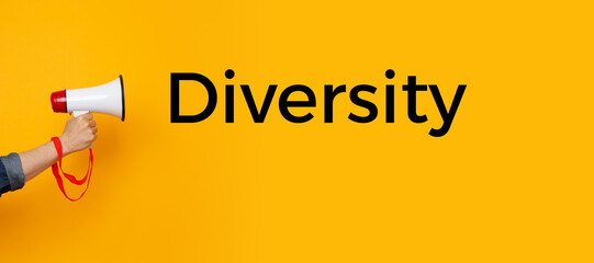 Hand with a megaphone and a diversity text	