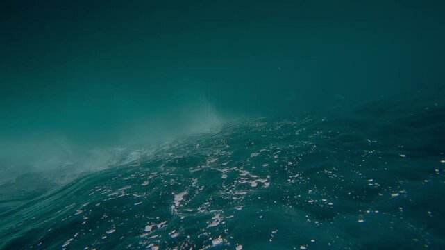 Ocean Waves During Storm. Harsh strong stormy waves make foam in open water of Pacific Ocean. Bad windy dangerous weather with grey cloudy sky. Extreme conditions for swimming. Powerful nature concept