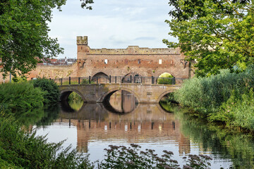 Berkelpoort, a 14th-century water gate in the city wall spanning the Berkel river in the Hanseatic city of Zutphen, Netherlands.