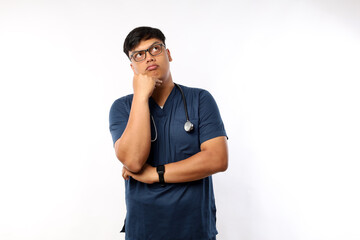 Healthcare workers, pandemic concept. Annoyed and bothered asian male doctor, nurse on her shift looking irritated or tired, eye roll bored and exhale, standing white background in scrubs