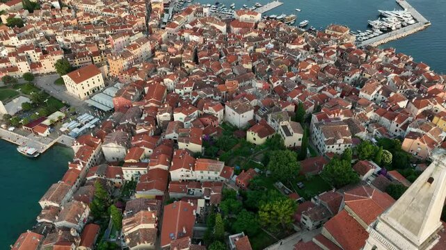 Drone shot over Rovinj city and tower of Church of St. Euphemia