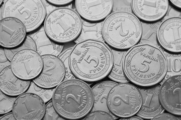 Ukrainian money, exchange coin, white coins of different denomination in random order.