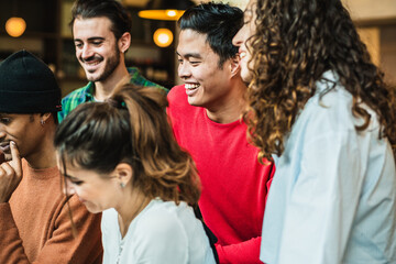 Group of young students is studying and having fun together