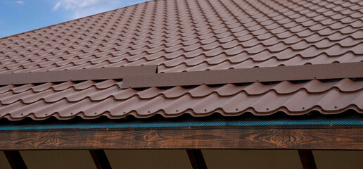 Metal roof tile and snow guard