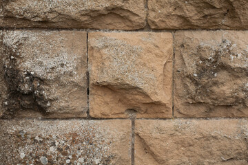 Texture of an Ancient Stone Wall in Beige