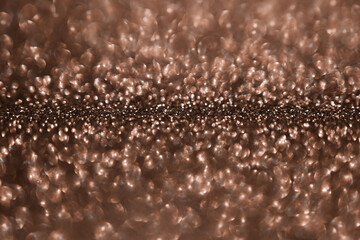 Mocha Mousse, brown sparkling glitter bokeh background, abstract defocused texture. Holiday lights. Demonstrating color, trend 2025 year