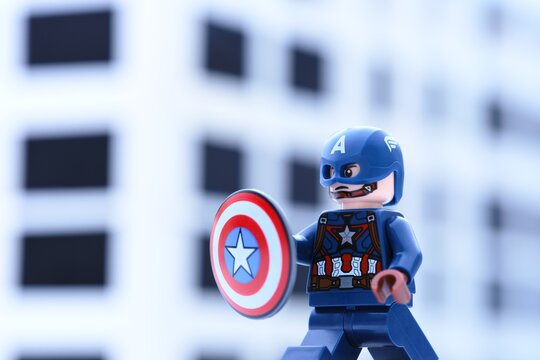 Tambov, Russian Federation - November 05, 2024 Lego Captain America minifigure with a shield against an office building