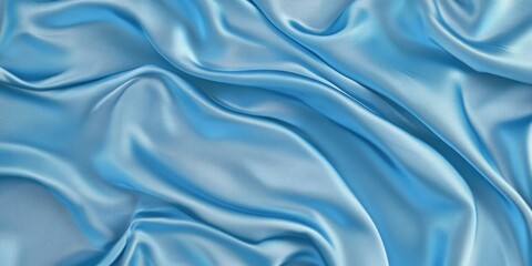 Abstract flowing silk fabric texture, beautiful draped shimmering satin background in baby blue