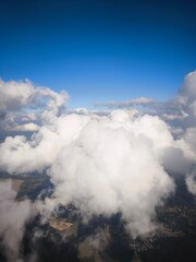 close up of clouds over europe taken from an airplane during the day