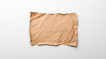 Obraz premium Crumpled brown paper sheet on a clean background.