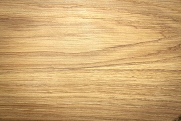 Natural wood background with a close-up texture of wooden grains