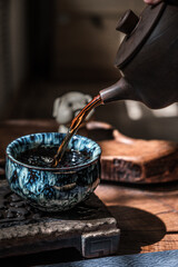 Artisan tea poured into a beautiful ceramic cup, creating an inviting atmosphere