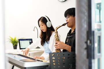 Working Asians are learning international musical skills at home