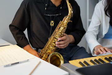 Working Asians are learning international musical skills at home