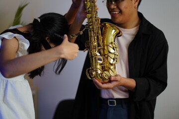 Working Asians are learning international musical skills at home