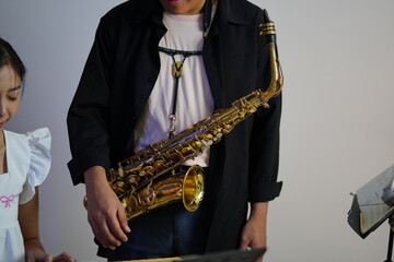Working Asians are learning international musical skills at home