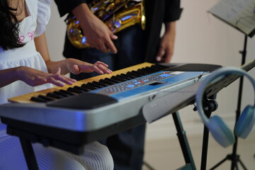 Working Asians are learning international musical skills at home