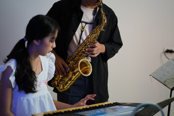 Working Asians are learning international musical skills at home